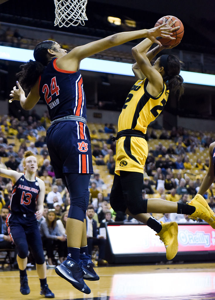 Auburn's Erin Howard attempts to block Missouri's Jordan Roundtree from a shot